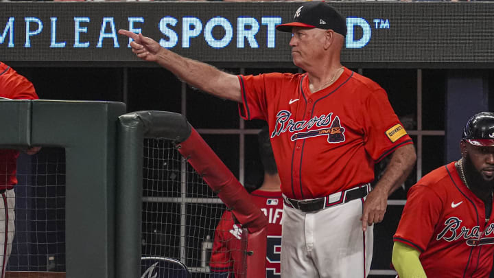 Aug 2, 2024; Cumberland, Georgia, USA; Atlanta Braves manager Brian Snitker (43) points from the dugout steps against the Miami Marlins during the eighth inning at Truist Park. Mandatory Credit: Dale Zanine-USA TODAY Sports