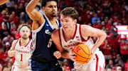 Nebraska forward Pryce Sandfort drives against Creighton guard Nik Graves at Pinnacle Bank Arena.