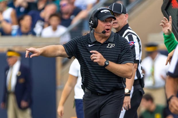 Purdue head coach Barry Odom points to the field against Notre Dame.
