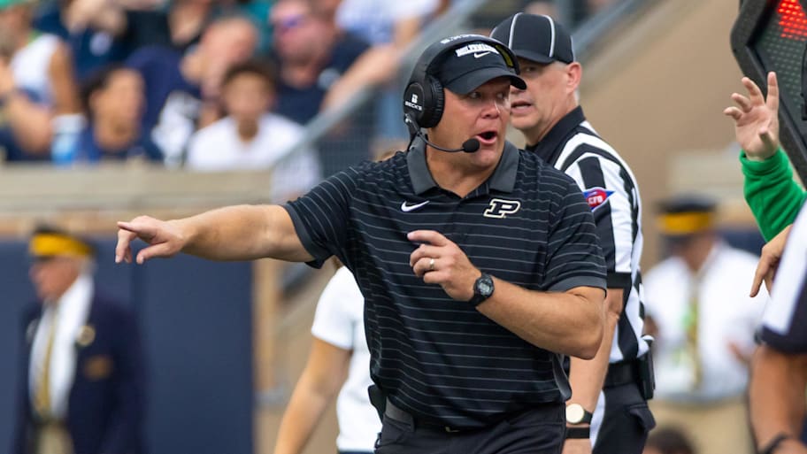 Purdue head coach Barry Odom points to the field against Notre Dame.
