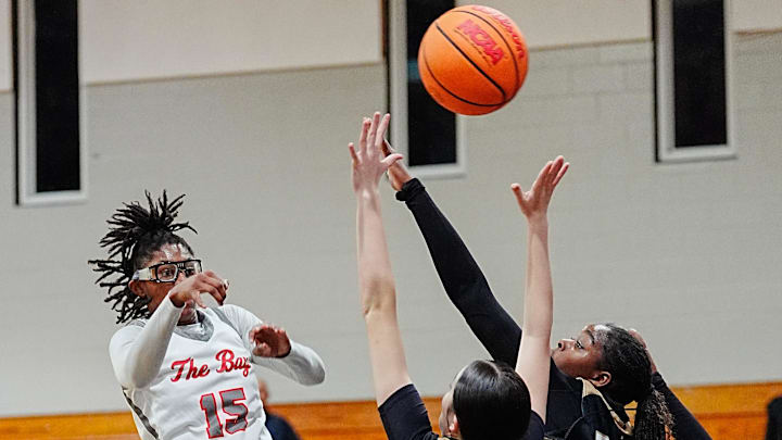 Jaida Civil of Palm Bay passes the ball over the Bishop Moore defense in the Region 1 finals of the FHSAA Class 4A girls basketball tournament Friday, February 21, 2025. Craig Bailey/FLORIDA TODAY via USA TODAY NETWORK