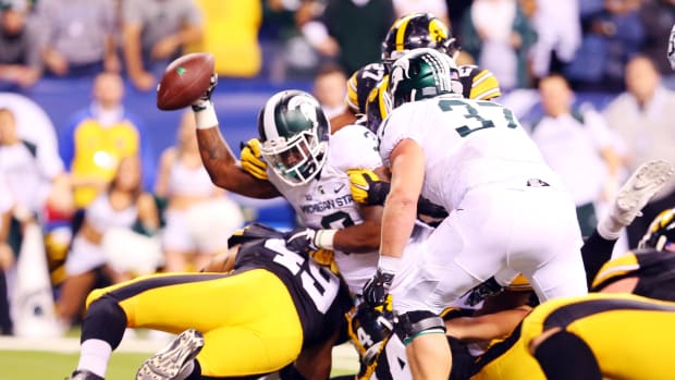 Michigan State Spartans running back LJ Scott dives in for a touchdown during the fourth quarter of the Big Ten Title game