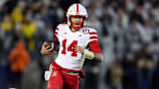 Nebraska Cornhuskers quarterback TJ Lateef (14) runs with the ball during the third quarter against the Penn State Nittany Lions at Beaver Stadium. 