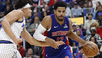 Oct 29, 2025; Detroit, Michigan, USA; Detroit Pistons forward Tobias Harris (12) dribbles while defended by Orlando Magic forward Noah Penda (93) in the second half at Little Caesars Arena.