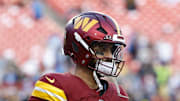Washington Commanders quarterback Marcus Mariota warms up before a game against the Detroit Lions.