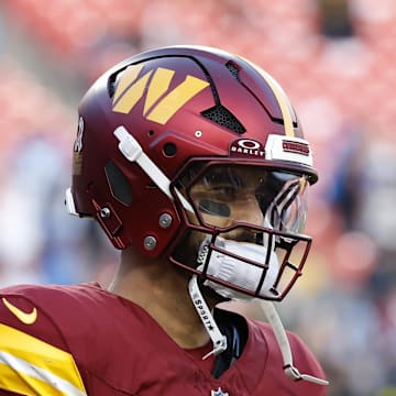 Washington Commanders quarterback Marcus Mariota warms up before a game against the Detroit Lions.