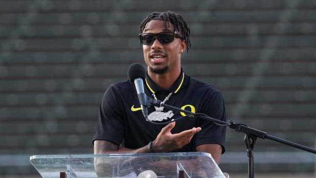 Oregon player Tez Johnson shares stories about teammate Khyree Jackson during a vigil at Autzen Stadium