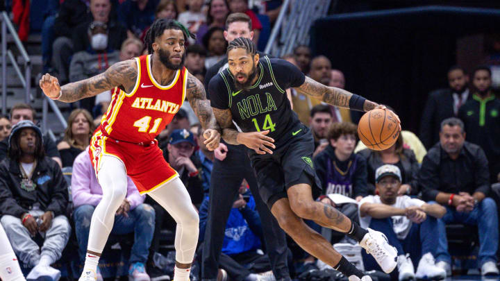 Nov 4, 2023; New Orleans, Louisiana, USA;  New Orleans Pelicans forward Brandon Ingram (14) dribbles against Atlanta Hawks forward Saddiq Bey (41) during the first half at Smoothie King Center. Mandatory Credit: Stephen Lew-USA TODAY Sports