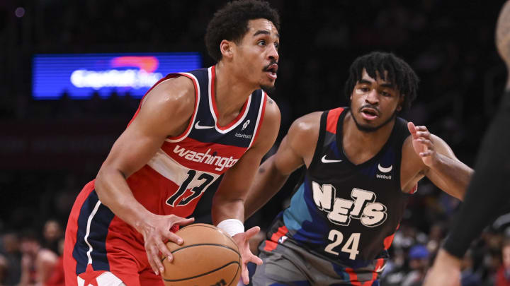 Mar 27, 2024; Washington, District of Columbia, USA;  Washington Wizards guard Jordan Poole (13) makes a move to the basket during the second  half on Brooklyn Nets guard Cam Thomas (24) at Capital One Arena. Mandatory Credit: Tommy Gilligan-USA TODAY Sports