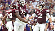 Mississippi State Bulldogs quarterback Blake Shapen (2) and running back Fluff Bothwell (24) celebrate after a touchdown against the Alcorn State Braves during the first half at Davis Wade Stadium at Scott Field. 