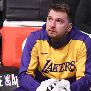 Apr 9, 2025; Dallas, Texas, USA;  Los Angeles Lakers guard Luka Doncic (77) reacts while watching a tribute video before the game against the Dallas Mavericks at American Airlines Center. Mandatory Credit: Kevin Jairaj-Imagn Images