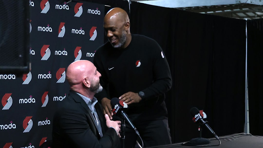 Apr 13, 2025; Portland, Oregon, USA; Portland Trail Blazers head coach Chauncey Billups interacts with Trail Blazers’ general manager Joe Cronin at the conclusion of a press conference before Portland plays their last season game against Los Angeles Lakers at Moda Center. Mandatory Credit: Jaime Valdez-Imagn Images