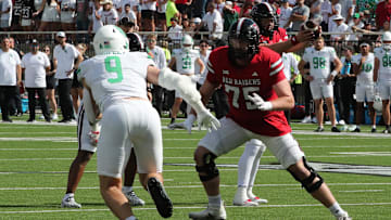 Sep 14, 2024; Lubbock, Texas, USA;  North Texas Mean Green defensive lineman Jake Shipley (9) rushes against Texas Tech Red Raiders offensive tackle Ty Buchanan (75) in the first half at Jones AT&T Stadium and Cody Campbell Field. Mandatory Credit: Michael C. Johnson-Imagn Images