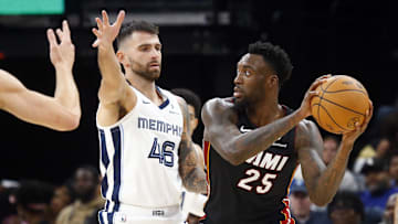 Oct 18, 2024; Memphis, Tennessee, USA; Miami Heat forward Nassir Little (25) handles the ball as Memphis Grizzlies guard John Konchar (46) defends during the second half at FedExForum. Mandatory Credit: Petre Thomas-Imagn Images