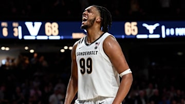 Vanderbilt forward Devin McGlockton (99) reacts after teammate Jaylen Carey scored against Texas during an NCAA college basketball game Saturday, Feb. 8, 2025, in Nashville, Tenn.
