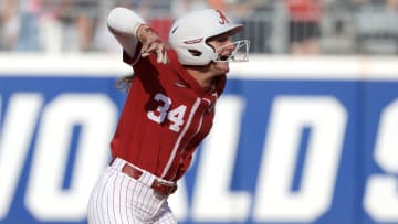 Alabama catcher Marlie Giles (34) celebrates after driving in a run on a double in the first inning of a Women's College World Series softball game between the Alabama Crimson Tide and the Duke Blue Devils at Devon Park in Oklahoma City, Friday, May 31, 2024. Alabama won 2-1.