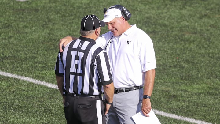 Sep 13, 2025; Morgantown, West Virginia, USA; West Virginia Mountaineers head coach Rich Rodriguez argues a call during the second quarter against the Pittsburgh Panthers at Milan Puskar Stadium. Mandatory Credit: Ben Queen-Imagn Images Sep 13, 2025; Morgantown, West Virginia, USA; West Virginia Mountaineers head coach Rich Rodriguez argues a call during the second quarter against the Pittsburgh Panthers at Milan Puskar Stadium. Mandatory Credit: Ben Queen-Imagn Images