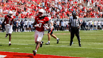 Sep 6, 2025; Raleigh, North Carolina, USA; North Carolina State Wolfpack running back Hollywood Smothers (3) runs with the football to score a touchdown during the second half of the game against Virginia Cavaliers at Carter-Finley Stadium. Mandatory Credit: Jaylynn Nash-Imagn Images
