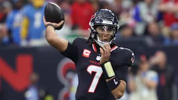 Jan 11, 2025; Houston, Texas, USA; Houston Texans quarterback C.J. Stroud (7) looks to pass during the first quarter against the Los Angeles Chargers in an AFC wild card game at NRG Stadium. Mandatory Credit: Troy Taormina-Imagn Images