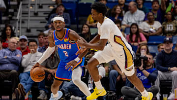 Nov 17, 2025; New Orleans, Louisiana, USA; Oklahoma City Thunder guard Shai Gilgeous-Alexander (2) dribbles against New Orleans Pelicans forward Herbert Jones (2) during the first half at Smoothie King Center. Mandatory Credit: Stephen Lew-Imagn Images