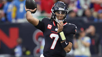 Houston Texans quarterback C.J. Stroud (7) looks to pass during the first quarter against the Los Angeles Chargers in an AFC wild-card game at NRG Stadium.