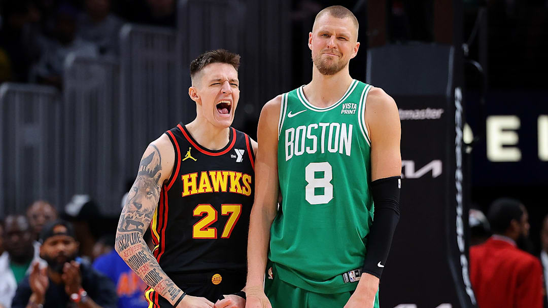 Vit Krejci flexes on his now-teammate Kristaps Porzingis, who is less than enthusiastic about the outburst.