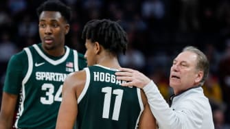 Michigan State head coach Tom Izzo talks to forward Xavier Booker (34) and guard A.J. Hoggard (11) during the second half of quarterfinal of Big Ten tournament at Target Center in Minneapolis, Minn. on Friday, March 15, 2024.