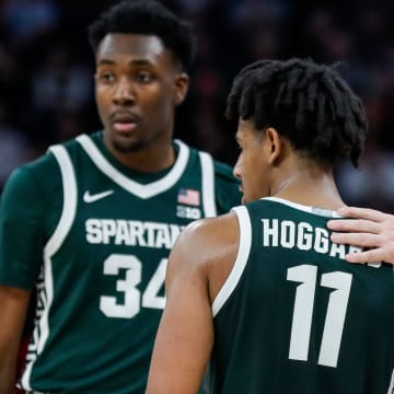 Michigan State head coach Tom Izzo talks to forward Xavier Booker (34) and guard A.J. Hoggard (11) during the second half of quarterfinal of Big Ten tournament at Target Center in Minneapolis, Minn. on Friday, March 15, 2024.