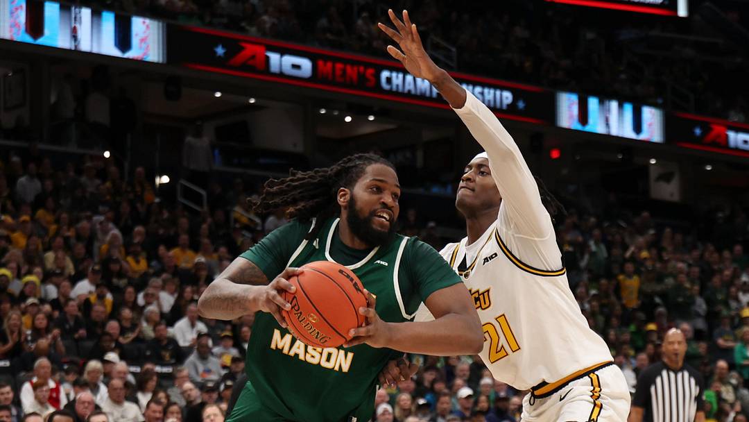 George Mason Patriots forward Jalen Haynes (11) drives to the basket as VCU Rams forward Christian Fermin (21)