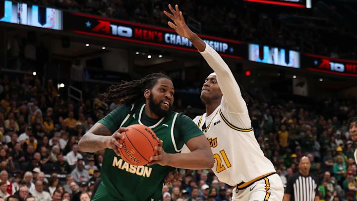 George Mason Patriots forward Jalen Haynes (11) drives to the basket as VCU Rams forward Christian Fermin (21)