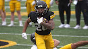 Iowa Hawkeyes running back Kamari Moulton (28) races down field after breaking a tackle during an open spring practice Saturday, April 20, 2024 at Kinnick Stadium in Iowa City, Iowa.