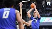 Jan 11, 2025; Indianapolis, Indiana, USA;  Creighton Bluejays center Ryan Kalkbrenner (11) attempts a shot over Butler Bulldogs forward Boden Kapke (33) during the second half at Hinkle Fieldhouse. Mandatory Credit: Robert Goddin-Imagn Images