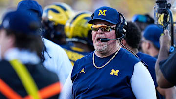 Michigan defensive coordinator Wink Martindale talks to players after a play against USC during the second half at Michigan Stadium in Ann Arbor on Saturday, Sept. 21, 2024.