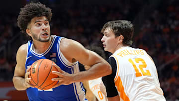 Duke forward Cameron Boozer (12) tries to get around Tennessee forward Cade Phillips (12) during a college basketball exhibition game on October 26, 2025, in Knoxville, Tenn.