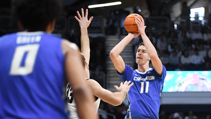 Jan 11, 2025; Indianapolis, Indiana, USA;  Creighton Bluejays center Ryan Kalkbrenner (11) attempts a shot over Butler Bulldogs forward Boden Kapke (33) during the second half at Hinkle Fieldhouse. Mandatory Credit: Robert Goddin-Imagn Images