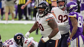 Dec 20, 2020; Minneapolis, Minnesota, USA; Chicago Bears defensive lineman John Jenkins (90) celebrates a tackle in the second quarter against the Minnesota Vikings at U.S. Bank Stadium. Mandatory Credit: Brad Rempel-Imagn Images