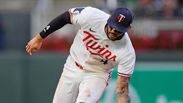 Jun 25, 2025; Minneapolis, Minnesota, USA; Minnesota Twins shortstop Carlos Correa (4) fields a ground ball against the Seattle Mariners in the sixth inning at Target Field. Mandatory Credit: Brad Rempel-Imagn Images