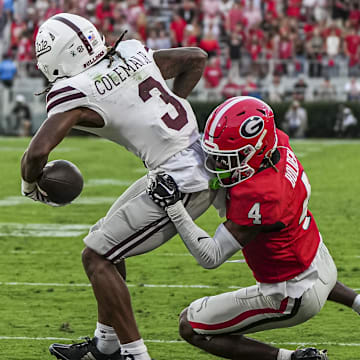Oct 12, 2024; Athens, Georgia, USA; Georgia Bulldogs defensive back KJ Bolden (4) tackles Mississippi State Bulldogs wide receiver Kevin Coleman Jr. (3) short on the end zone during the second half at Sanford Stadium. Mandatory Credit: Dale Zanine-Imagn Images