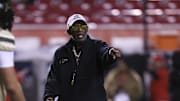Oct 25, 2025; Salt Lake City, Utah, USA; Colorado Buffaloes head coach Deion Sanders coaches before the game against the Utah Utes at Rice-Eccles Stadium. Mandatory Credit: Rob Gray-Imagn Images