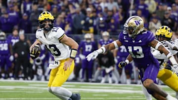 Oct 5, 2024; Seattle, Washington, USA; Michigan Wolverines quarterback Jack Tuttle (13) looks to pass against the Washington Huskies during the third quarter at Alaska Airlines Field at Husky Stadium. Mandatory Credit: Joe Nicholson-Imagn Images