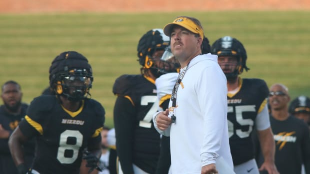 Missouri Tigers head coach Eli Drinkwitz looks onto the practice field at the team's annual fan night practice at Faurot Fiel