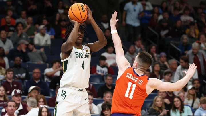 Mar 24, 2024; Memphis, TN, USA; Baylor Bears guard Ja'Kobe Walter (4) shoots against Clemson Tigers guard Joseph Girard III (11) in the second half in the second round of the 2024 NCAA Tournament at FedExForum. 
