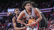 Jan 28, 2025; Athens, Georgia, USA; Georgia Bulldogs forward Asa Newell (14) grabs a rebound between South Carolina Gamecocks guard Zachary Davis (2) and forward Nick Pringle (5) during the second half at Stegeman Coliseum. Mandatory Credit: Dale Zanine-Imagn Images