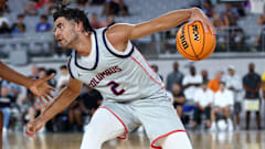 5-star prospect Cayden Boozer attempts to make a move in the paint during high school playoffs. 