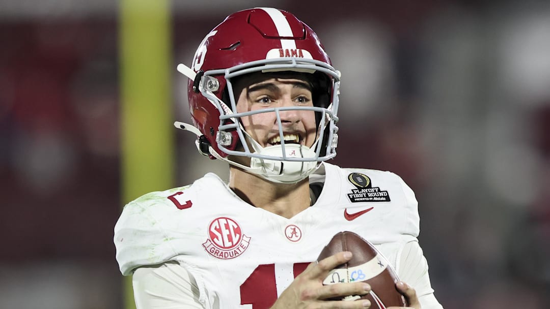 Dec 19, 2025; Norman, OK, USA; Alabama Crimson Tide quarterback Ty Simpson (15) celebrates a win after a game against the  Oklahoma Sooners at Gaylord Family OK Memorial Stadium. Mandatory Credit: Nelson Chenault-Imagn Images