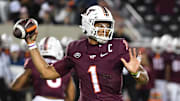 Oct 24, 2025; Blacksburg, Virginia, USA;  Virginia Tech Hokies quarterback Kyron Drones (1) throws a pass against the California Golden Bears during the second quarter at Lane Stadium. Mandatory Credit: Brian Bishop-Imagn Images