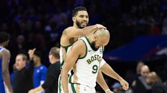 Nov 15, 2023; Philadelphia, Pennsylvania, USA; Boston Celtics forward Jayson Tatum (0) congratulates guard Derrick White (9) after his three-pointer against the Philadelphia 76ers during the fourth quarter at Wells Fargo Center. Mandatory Credit: Bill Streicher-Imagn Images