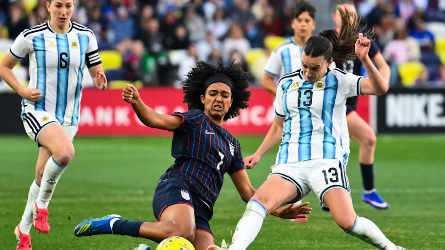 United States midfielder Lily Yohannes tackles Argentina defender Sophia Braun
