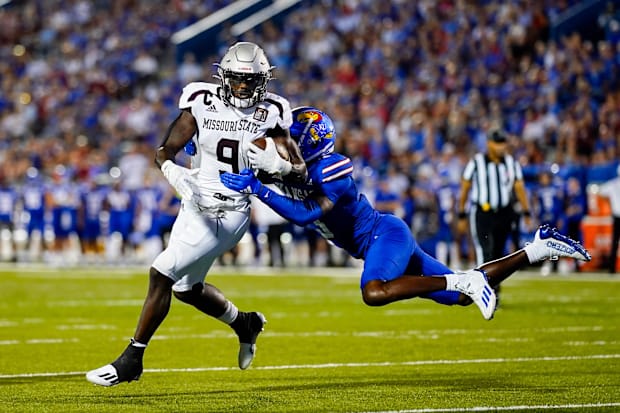 Missouri State Bears running back Jacardia Wright (9) is tackled by Kansas Jayhawks cornerback Mello Dotson (3) Missouri State Bears running back Jacardia Wright (9) is tackled by Kansas Jayhawks cornerback Mello Dotson (3)
