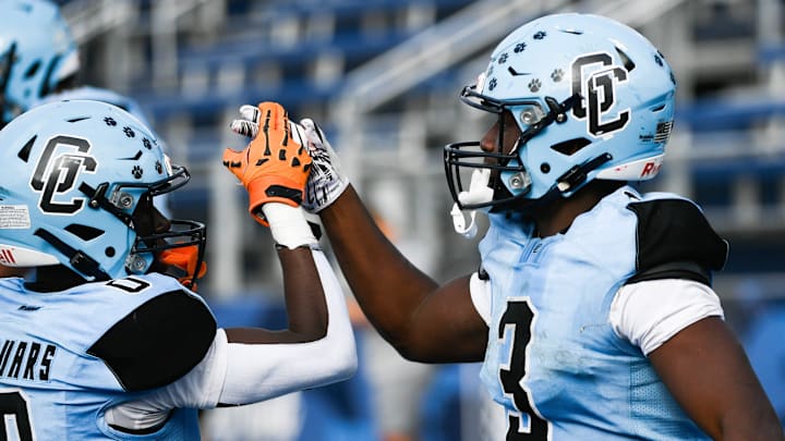 Devonte Roberts of Gadsden County congratulates teammate Kemarrion Battles after he scored a touchdown in the FHSAA football Class 2A state championship Thursday, December 12, 2024. Craig Bailey/FLORIDA TODAY via USA TODAY NETWORK Devonte Roberts of Gadsden County congratulates teammate Kemarrion Battles after he scored a touchdown in the FHSAA football Class 2A state championship Thursday, December 12, 2024. Craig Bailey/FLORIDA TODAY via USA TODAY NETWORK